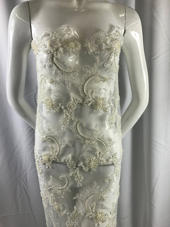 Amazing ivory pearl design embroider and heavy beaded on a mesh lace-prom-nightgown-wedding-bridal-decorations-sold by the yard.