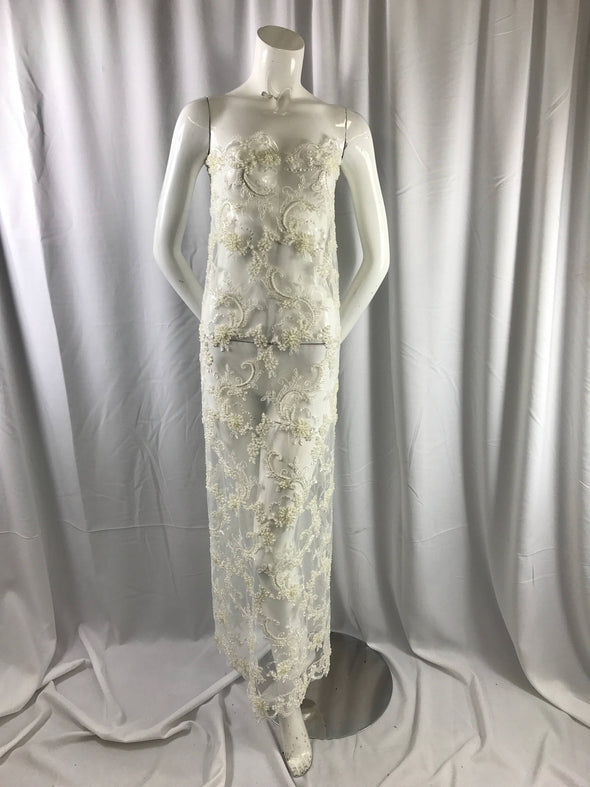 Amazing ivory pearl design embroider and heavy beaded on a mesh lace-prom-nightgown-wedding-bridal-decorations-sold by the yard.