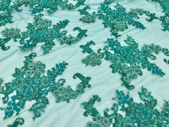 Teal green 3D floral design embroider with sequins and hand beaded with metallic tread on a mesh lace-fashion-dresses-sold by the yard.