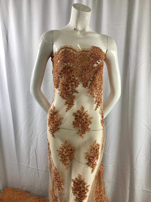 Cinnamon charming design embroider and beaded on a mesh lace-prom-nightgown-bridal-wedding-apparel-fashion-sold by the yard.