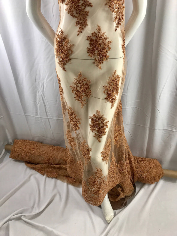 Cinnamon charming design embroider and beaded on a mesh lace-prom-nightgown-bridal-wedding-apparel-fashion-sold by the yard.