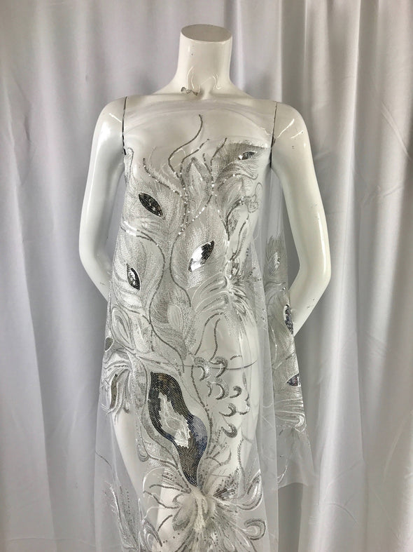 White peacock feathers embroider with shiny silver sequins on a white mesh-apparel-fashion-decorations-dresses-nightgown-sold by 2 panels.