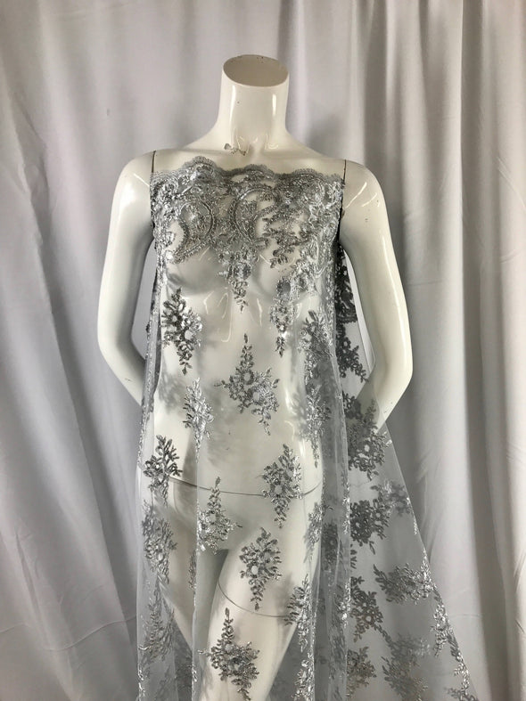 Gray paisly flowers embroider and corded with metallic silver tread on a mesh lace-wedding-bridal-prom-nightgown-dresses-sold by the yard.