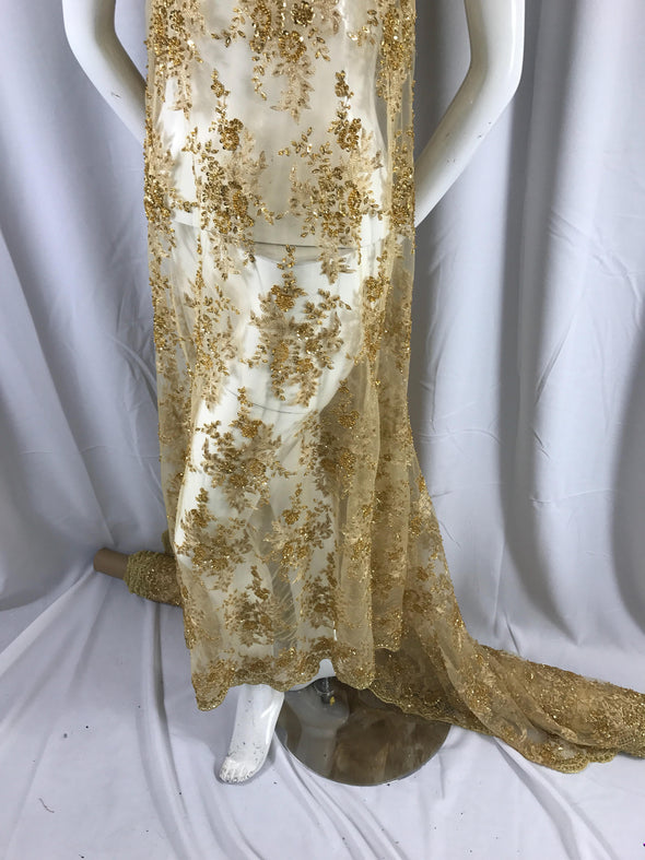 Gorgeous gold French design embroider and beaded on a mesh lace. Wedding/Bridal/Prom/Nightgown fabric-dresses-apparel-fashion-sold by yard.