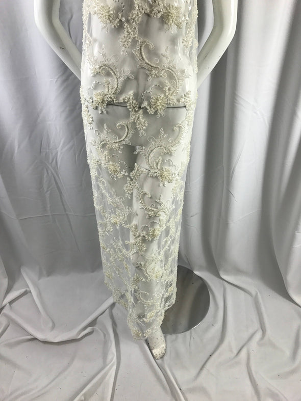 Amazing ivory pearl design embroider and heavy beaded on a mesh lace-prom-nightgown-wedding-bridal-decorations-sold by the yard.