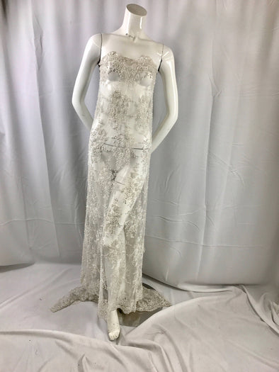 Gorgeous off white French design embroider and beaded on a mesh lace. Wedding/Bridal/Prom/Nightgown/dresses/fashion/sold by the yard.