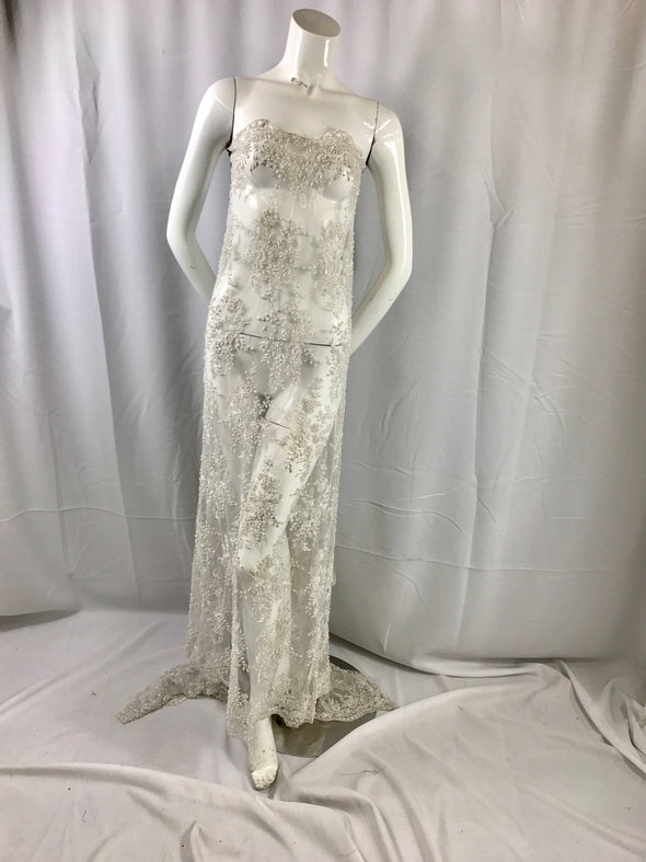 Gorgeous off white French design embroider and beaded on a mesh lace. Wedding/Bridal/Prom/Nightgown/dresses/fashion/sold by the yard.