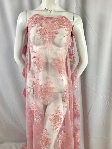 Pink flowers embroider on a mesh lace. Bridal-wedding-prom-nightgown fabric-dresses-apparel-fashion-decorations-sold by the yard.