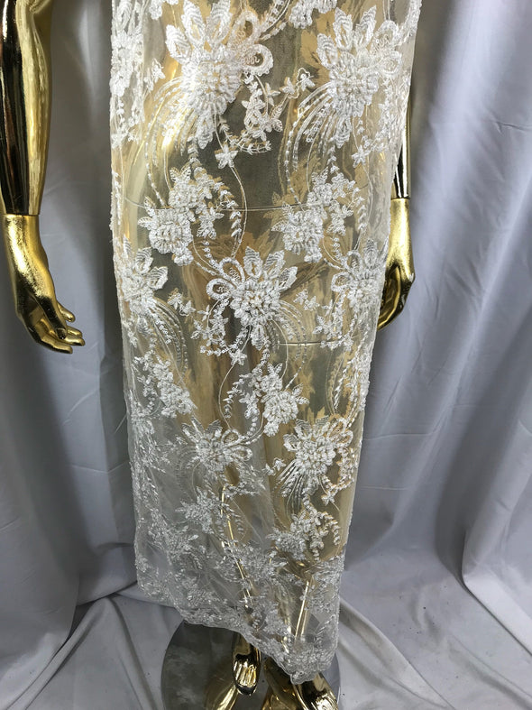 Ivory hand beaded floral design embroider on a mesh lace-dresses-fashion-apparel-wedding-prom-nightgown-decorations-sold by the yard.