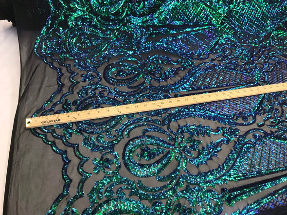 Green princess design iridescent sequins embroidery on a 4 way stretch black mesh-dresses-apparel-prom-nightgown-fashion-sold by the yard.