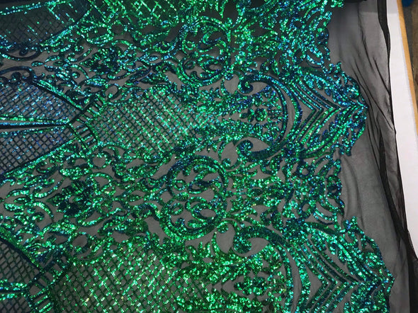 Green princess design iridescent sequins embroidery on a 4 way stretch black mesh-dresses-apparel-prom-nightgown-fashion-sold by the yard.