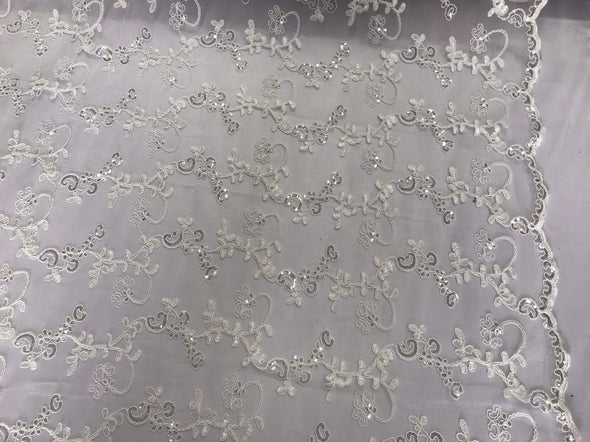 Ivory floral embroidery with shiny sequins and cord on a mesh lace-dresses-fashion-prom-nightgown-apparel-sold by the yard.