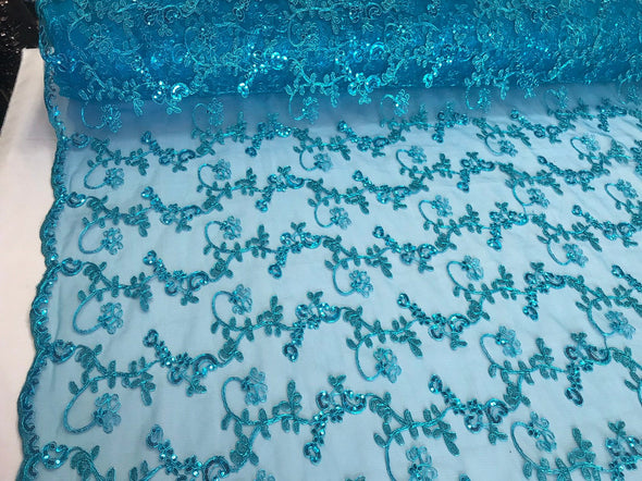 Turquoise metallic floral embroidery with shiny sequins and cord on a mesh lace-dresses-fashion-apparel-prom-nightgown-sold by the yard.