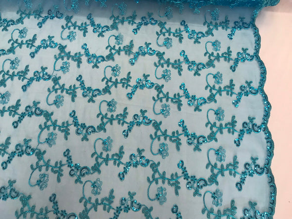 Turquoise metallic floral embroidery with shiny sequins and cord on a mesh lace-dresses-fashion-apparel-prom-nightgown-sold by the yard.
