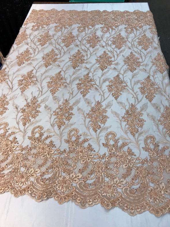 Peach hand beaded vine design embroidery with flowers on a mesh lace-Sold by the yard.