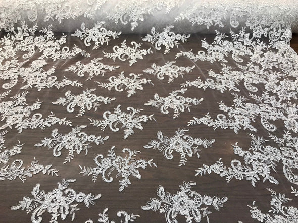 White floral design embroidery with shiny  sequins on a mesh lace-dresses-fashion-apparel-prom-nightgown-sold by the yard.