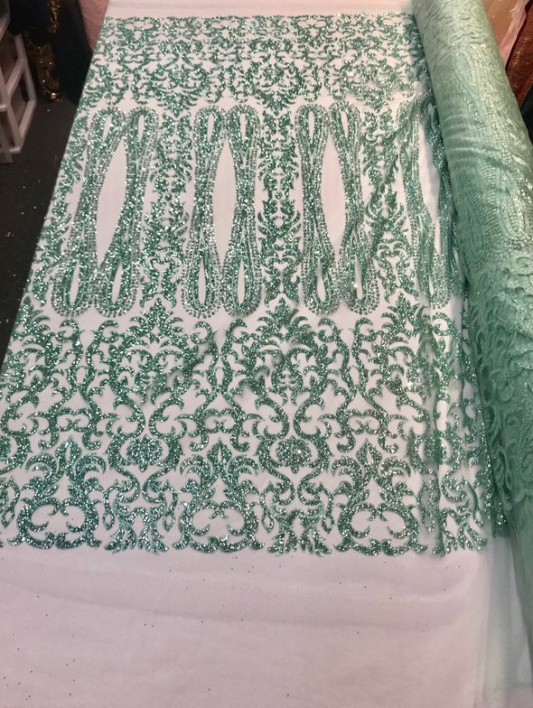 Aqua shiny glitter damask design on a mesh lace-dresses-fashion-apparel-prom-nightgown-decorations-sold by the yard.