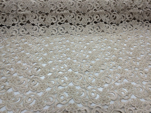 Metallic gold flowers embroider and hand beaded organza lace.36x50inches. Sold by the yard.