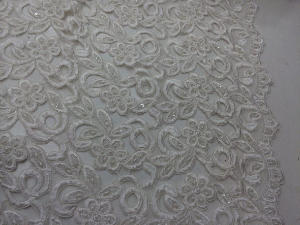 Ivory flowers embroider and hand beaded organza lace.36x50inches. Sold by the yard.