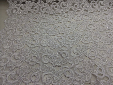 White flowers embroider and hand beaded organza lace.36x50inches. Sold by the yard.