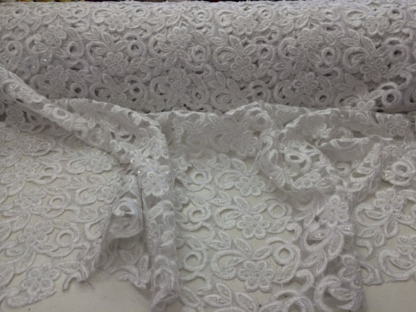 White flowers embroider and hand beaded organza lace.36x50inches. Sold by the yard.