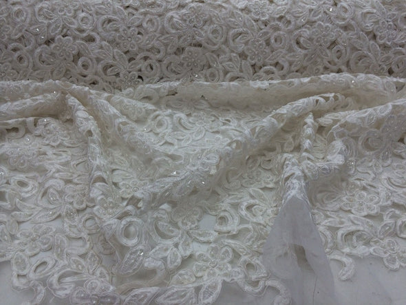 Ivory flowers embroider and hand beaded organza lace.36x50inches. Sold by the yard.