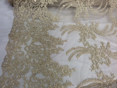 Dark ivory french design embroidered and heavy beaded on a mesh lace.36x50inches. Bridal-wedding fabric lace. Sold by the yard.