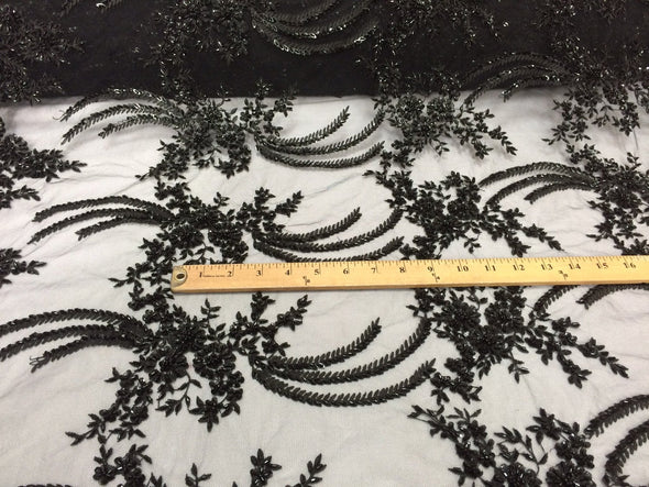 Black french design embroidered and heavy beaded on a mesh lace.36x50inches.Wedding-bridal fabric lace. Sold by the yard.