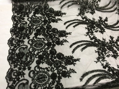 Black french design embroidered and heavy beaded on a mesh lace.36x50inches.Wedding-bridal fabric lace. Sold by the yard.