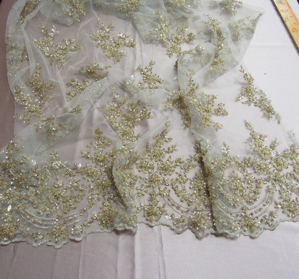Luxurious Gold French design embroider and beaded on a mesh lace. Wedding/Bridal/Prom/Nightgown fabric.