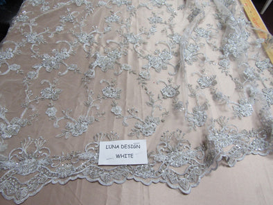 Elegant metallic white French design embroider and beaded on a mesh lace. Wedding/Bridal/Prom/Nightgown fabric.