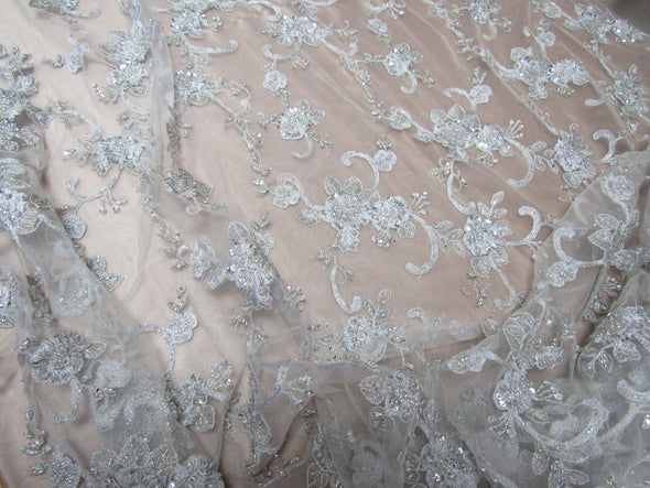 Elegant metallic white French design embroider and beaded on a mesh lace. Wedding/Bridal/Prom/Nightgown fabric.
