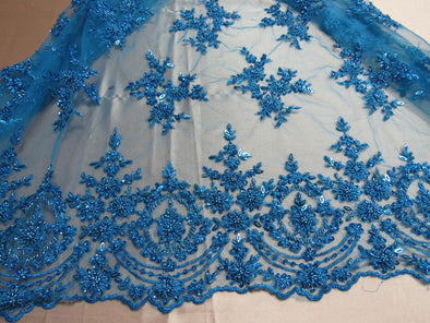 Luxurious turquoise French design embroider and beaded on a mesh lace. Wedding/Bridal/Prom/Nightgown fabric.