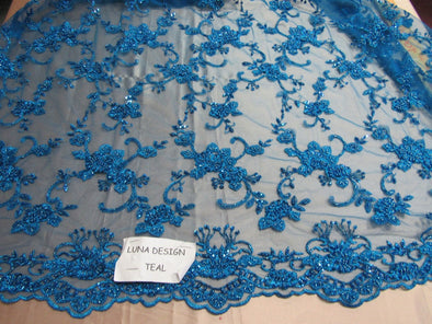 Elegant teal blue French design embroider and beaded on a mesh lace. Wedding/Bridal/Prom/Nightgown fabric.