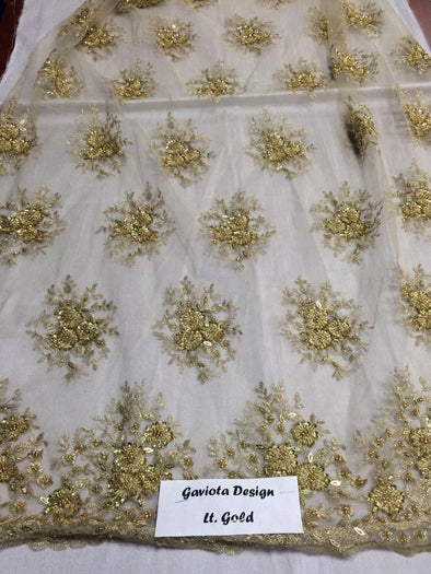 Light Gold Gaviota design embroider and beaded on a mesh lace. Wedding/Bridal/Nightgown/Prom fabric. Sold by the yard.