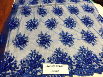 Royal blue gaviota design embroider and beaded on a mesh lace. Wedding/Bridal/Prom/Nightgown fabric. Sold by the yard.