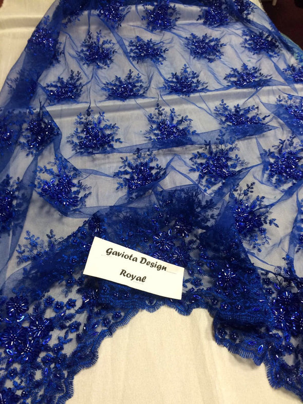Royal blue gaviota design embroider and beaded on a mesh lace. Wedding/Bridal/Prom/Nightgown fabric. Sold by the yard.