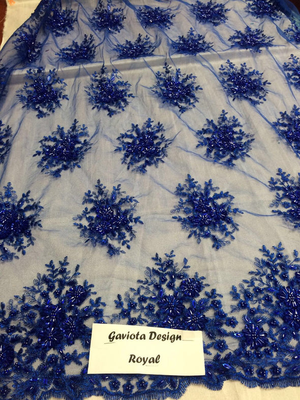 Royal blue gaviota design embroider and beaded on a mesh lace. Wedding/Bridal/Prom/Nightgown fabric. Sold by the yard.