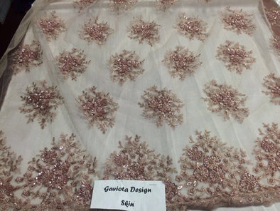 Skin color gaviota design embroider and beaded on a mesh lace. Wedding/Bridal/Prom/Nightgown fabric. Sold by the yard.