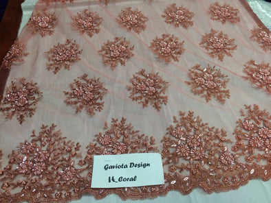 Light Coral Gaviota design embroider and beaded on a mesh lace. Wedding/Bridal/Prom/nightgown fabric. Sold by the yard.