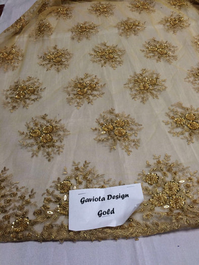 Gold gaviota design embroider and beaded on a mesh lace. Wedding/Bridal/Prom/Nightgown fabric. Sold by the yard.