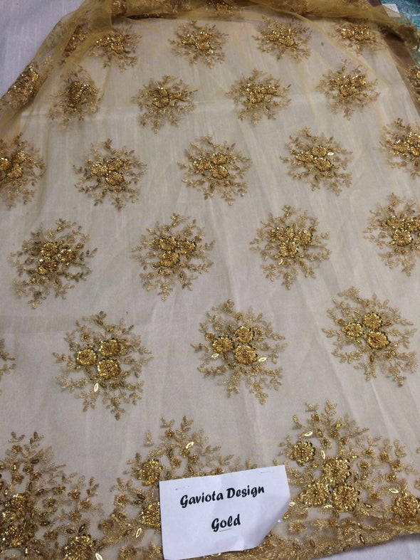 Gold gaviota design embroider and beaded on a mesh lace. Wedding/Bridal/Prom/Nightgown fabric. Sold by the yard.