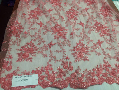 Gorgeous lt. Coral flower design embroider and beaded on a mesh lace. Wedding/Bridal/Prom/Nightgown fabric. Sold by the yard.