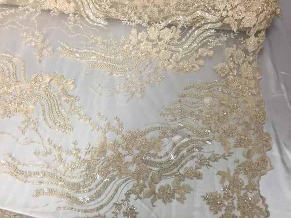 Unique cream/beige french design embroider and beaded on a mesh lace. Wedding/Bridal/Prom/Nightgown faveic. Sold by the yard.