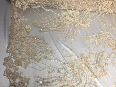 Unique cream/beige french design embroider and beaded on a mesh lace. Wedding/Bridal/Prom/Nightgown Fabric. Sold by the yard.