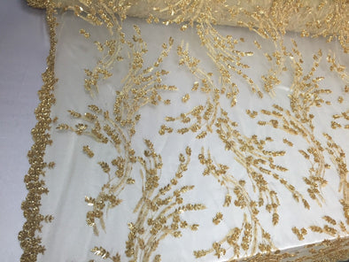 Gold flowers embroider and beaded on a mesh lace. Wedding/Bridal/prom/Nightgown fabric. Sold by the yard.