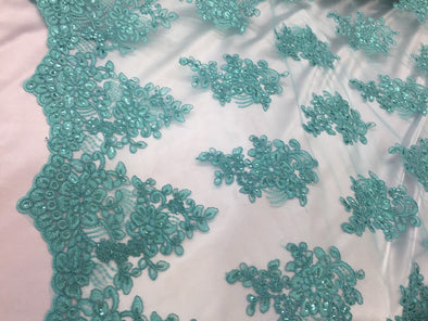 Aqua flower lace corded and embroider with sequins on a mesh. Wedding/bridal/prom/nightgown fabric. Sold by the yard.