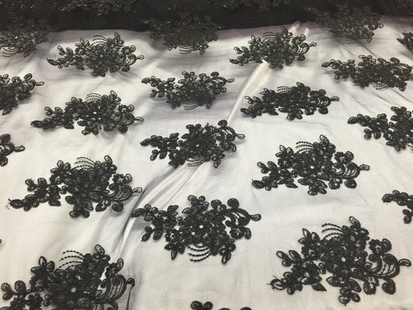 Black flower lace corded and embroider with sequins on a mesh. Wedding/bridal/prom/nightgown fabric. Sold by the yard.