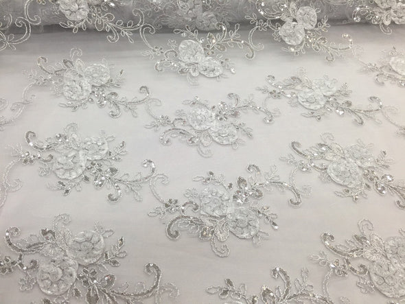 White/silver 3d flowers embroider with sequins on a white mesh lace. Wedding/bridal/prom/nightgown fabric-dresses-fashion-Sold by the yard.