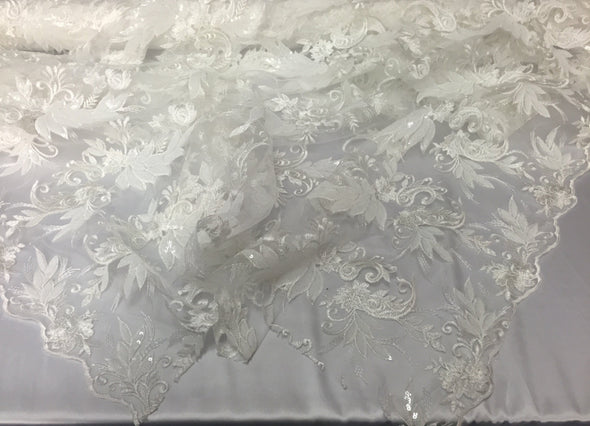 White paisley flowers embroider with sequins on a mesh lace fabric. Wedding-bridal-prom-nightgown- sold by the yard.